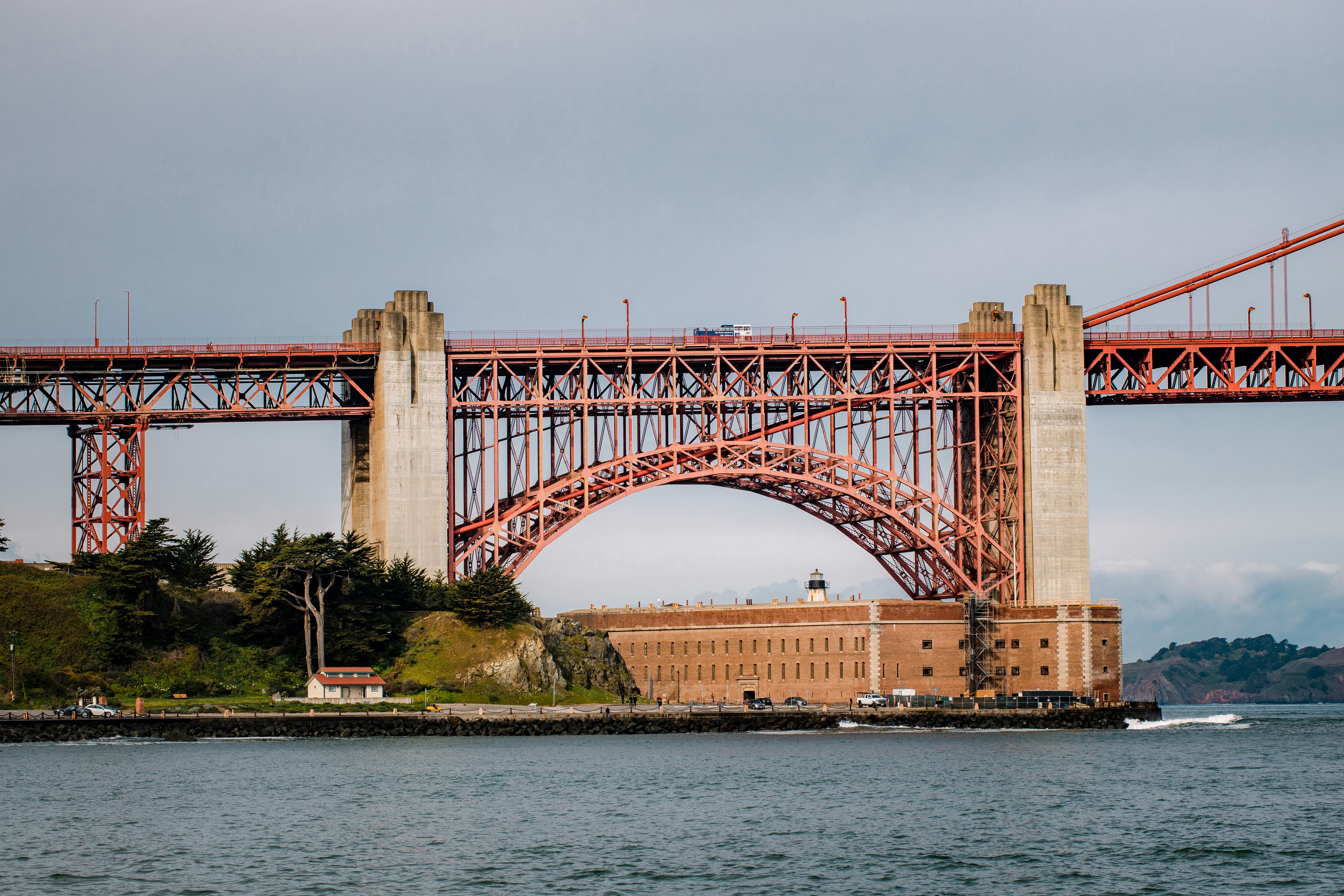 white and brown bridge over river during daytime